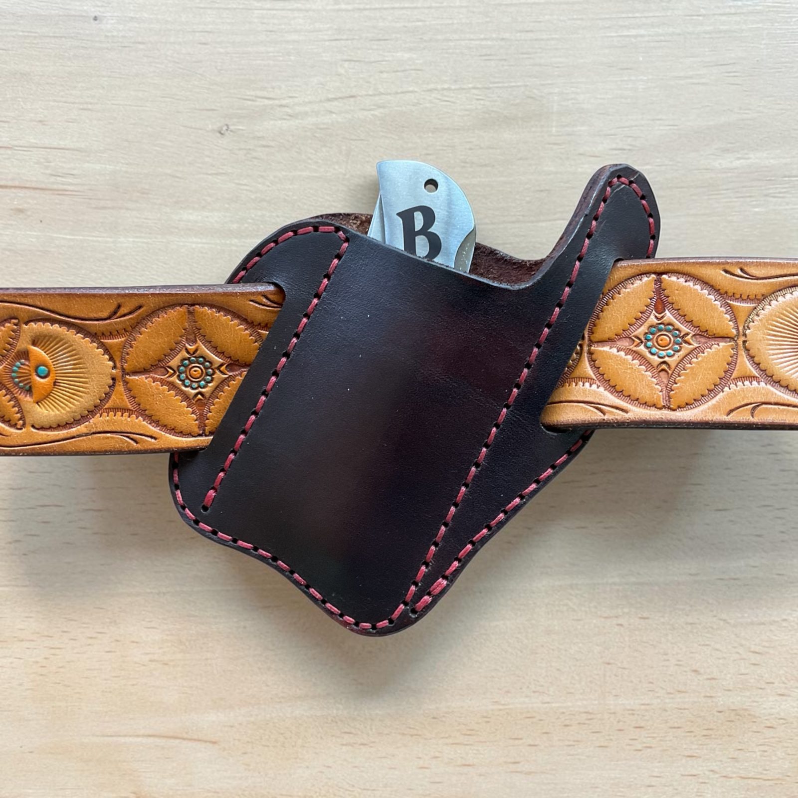 Angle belt style pocket knife sheath. Mahogany wirh red thread. Made from top grain leather. thumbnail 2